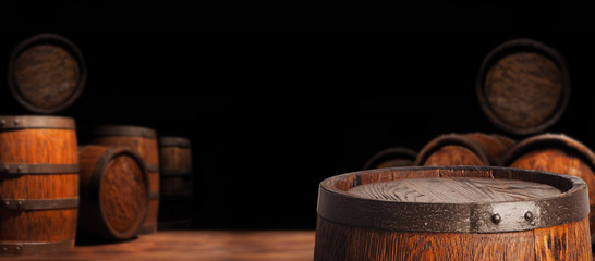 Rustic wooden barrel on a night background