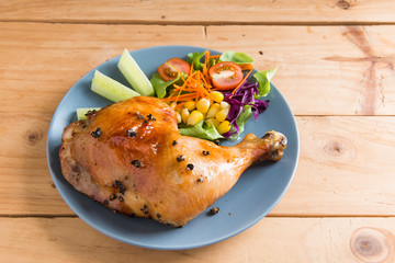 Roasted chicken leg with sauce and black pepper