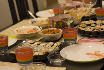 sushi colorful mix served dinner with wine, glasses, on table at restaurant, evening date, food photography