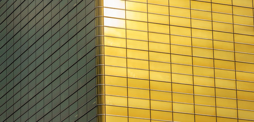 Sun reflected in golden building side