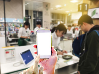 Point of sale technology of concept with hand holding smartphone for use application for paying online technology replace cash money