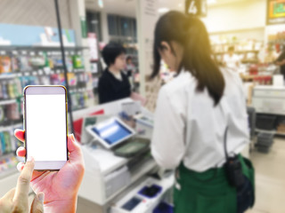 Point of sale technology of concept with hand holding smartphone for use application for paying online technology replace cash money