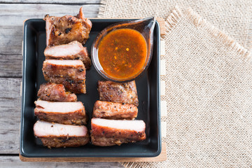 Grilled barbecue pork ribs on plate table background