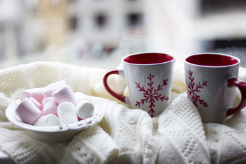 Marshmallows with a couple of christmas coffee cups