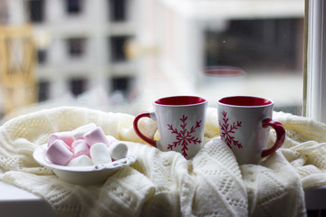 Marshmallows with a couple of christmas coffee cups
