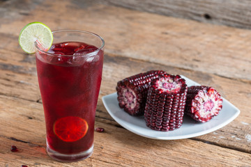 Purple corn juice wood table background