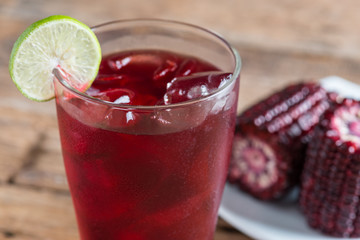 Purple corn juice wood table background