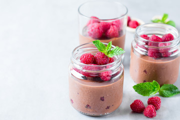 Healthy yogurt with fresh raspberries, selective focus