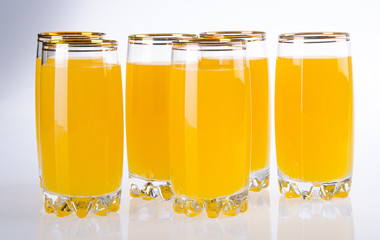 Full glass of orange juice on background
