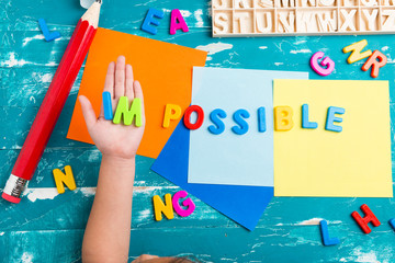 Children play plastic letters to combinations word 