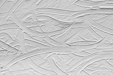Background of a white wall with a picture of plaster. Texture of paint with patterns.