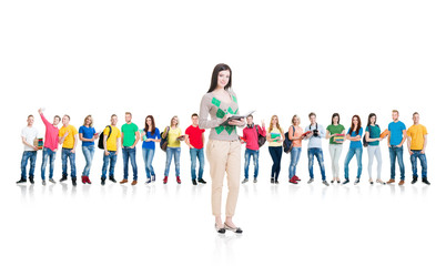 Obraz premium Large group of teenage students isolated on white background. Many different people standing together. School, education, college, university concept.