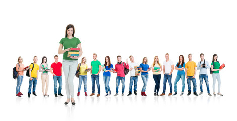 Obraz premium Large group of teenage students isolated on white background. Many different people standing together. School, education, college, university concept.