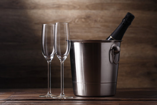 Image of two empty wine glasses, bottle of champagne