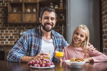 father and daughter having breakfast
