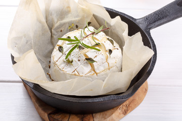 Baked camembert cheese with thyme and pepper