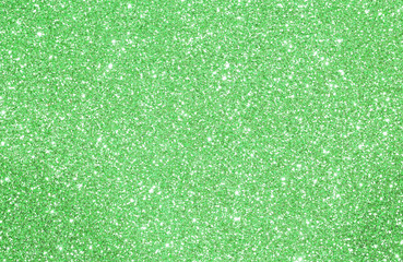 Green glittered background with glittering lights and reflection