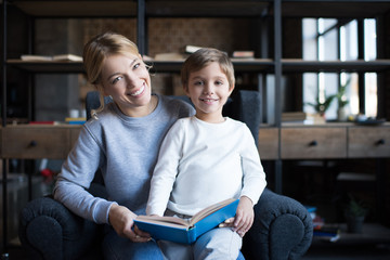 mother and son with book