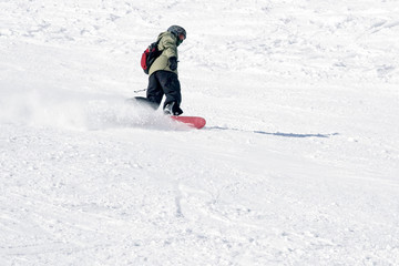 Fototapeta na wymiar snowboarder on the descent