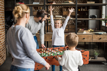 family playing table football