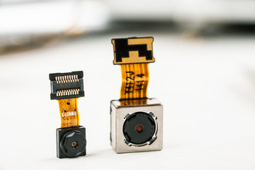 Smartphone camera modules on a white background, closeup
