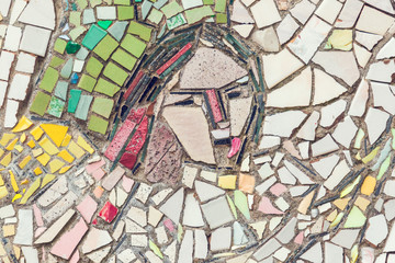 Obraz premium Detail of beautiful old abstract ceramic mosaic with the image of the woman's face