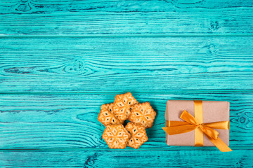 New Year and Christmas backgrounds. Backgrounds and textures. Cookies in the form of snowflakes and gift box.