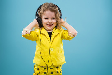 Cute young girl in earphones