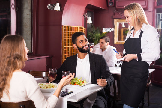 Spouses having date in restaurant
