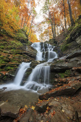 Fototapeta na wymiar Landscape of waterfall Shypit in the Ukrainian Carpathian Mountains on the long exposure in autumn