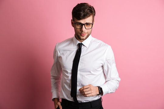 Portrait of a confident charming man in white shirt