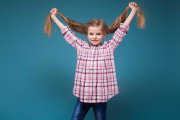 Little beauty girl in shirt with long brown hair