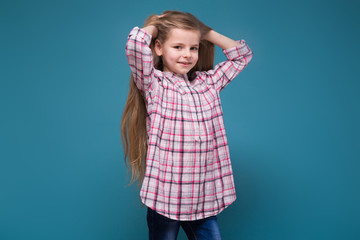 Little beauty girl in shirt with long brown hair