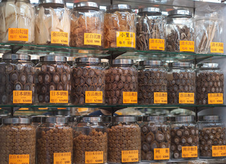 Pots of dried abalone in chinese shop