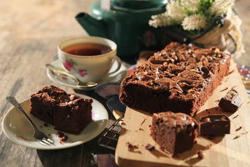 abstract topping chocolate brownies sliced cake with black tea 