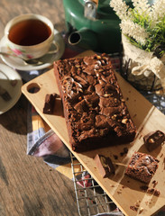 abstract topping chocolate brownies sliced cake with black tea 