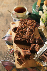 abstract topping chocolate brownies sliced cake with black tea 