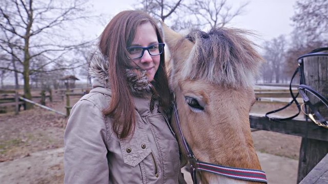 Female person happy hug pony horse 4K