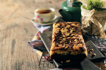 abstract topping chocolate brownies sliced cake with black tea 