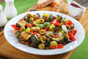 close-up of stewed eggplant with herbs