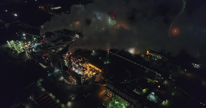 Night aerial shot of  the oil refinery. Lots of lights. Industrial areal.