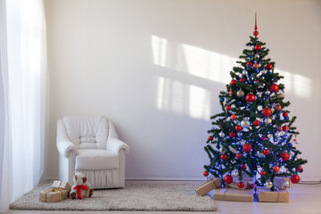 Christmas tree in a white room for Christmas with gifts