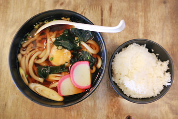Top view of Udon serve with rice on the wood table. Japanese food.