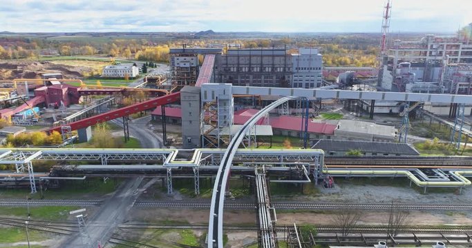 Beautiful aerial footage of big industrial area. Big pipes with smokestacks.