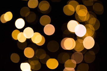blurred golden lights over dark background