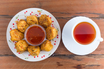 Chicken tofu with a cup of tea.