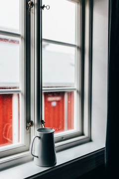 Jug on window sill