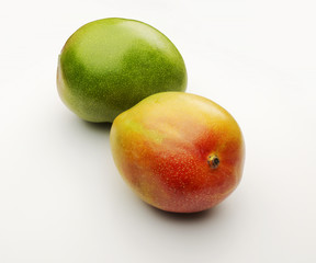 two ripe mango fruits isolated on white