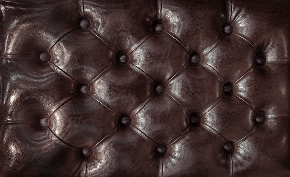 Decorative background of genuine leather with coach-type screed capitone chesterfield texture