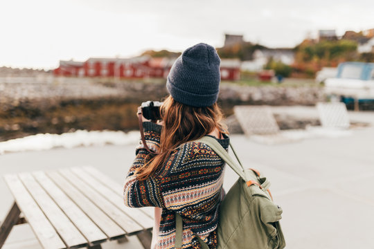 Woman with backpack and camera